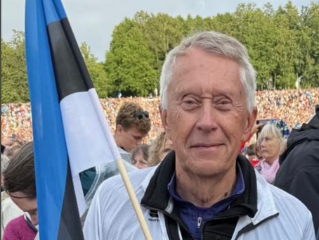 Man posing with Estonian flag