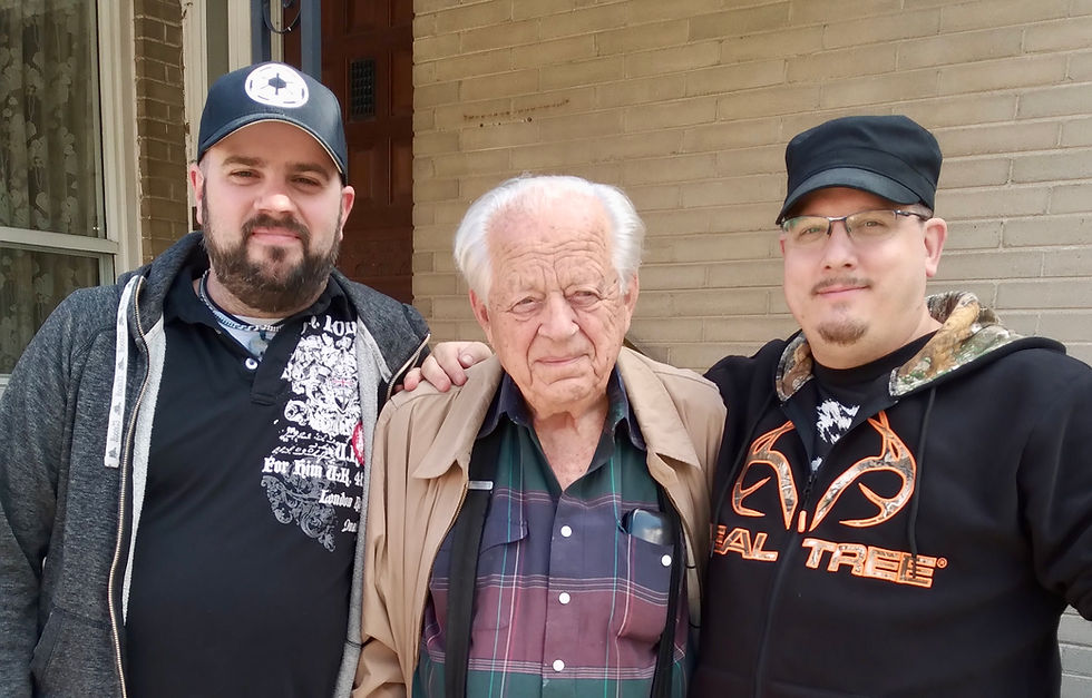 Elderly man posing with grandsons