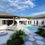 Thumbnail: Elegant residence with a clean modern design, tree-lined entry, and pool for outdoor relaxation.