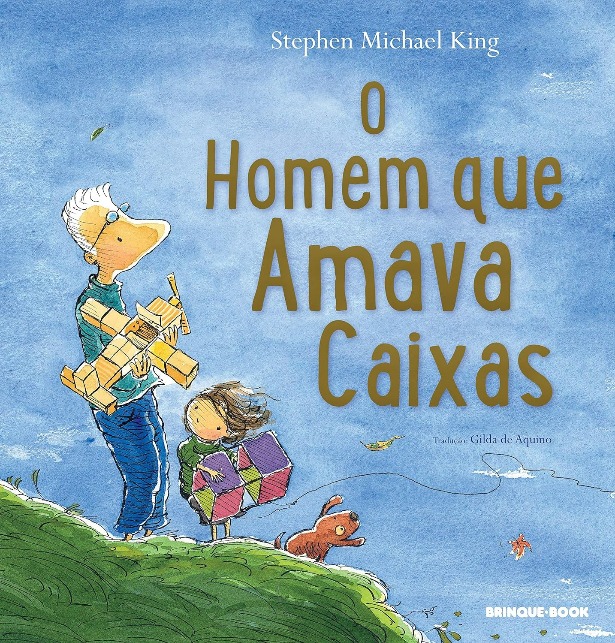Capa do livro. Em cima de um morro, pai e filo seguram aviões feitos de caixa de papel.