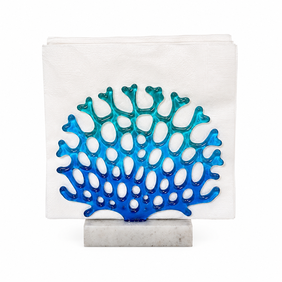Handmade glass coral napkin holder in blue coastal tones with a sand base