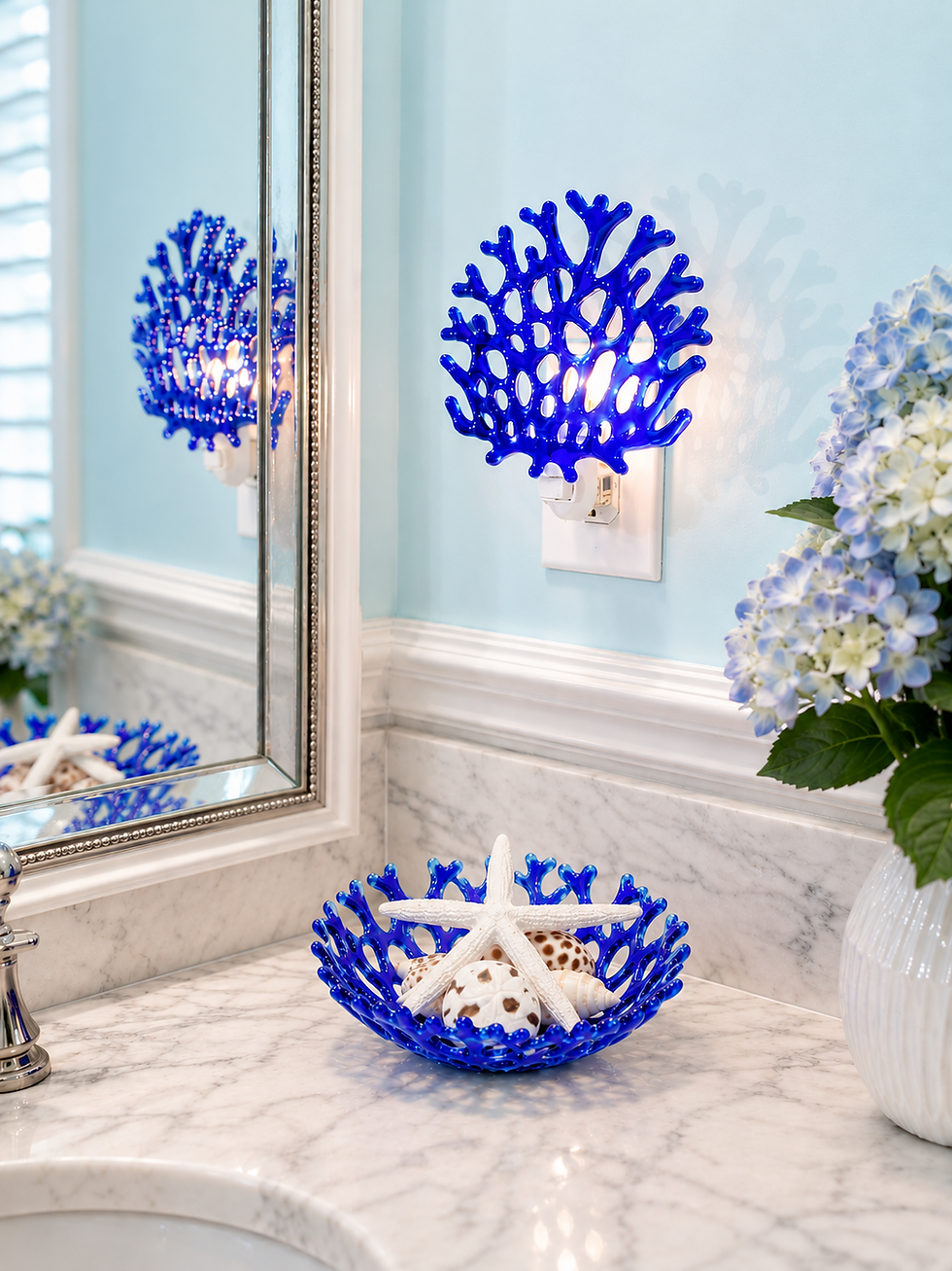Thumbnail: Cobalt blue glass coral nightlight and matching small coral bowl gift set with coastal bathroom decor styling