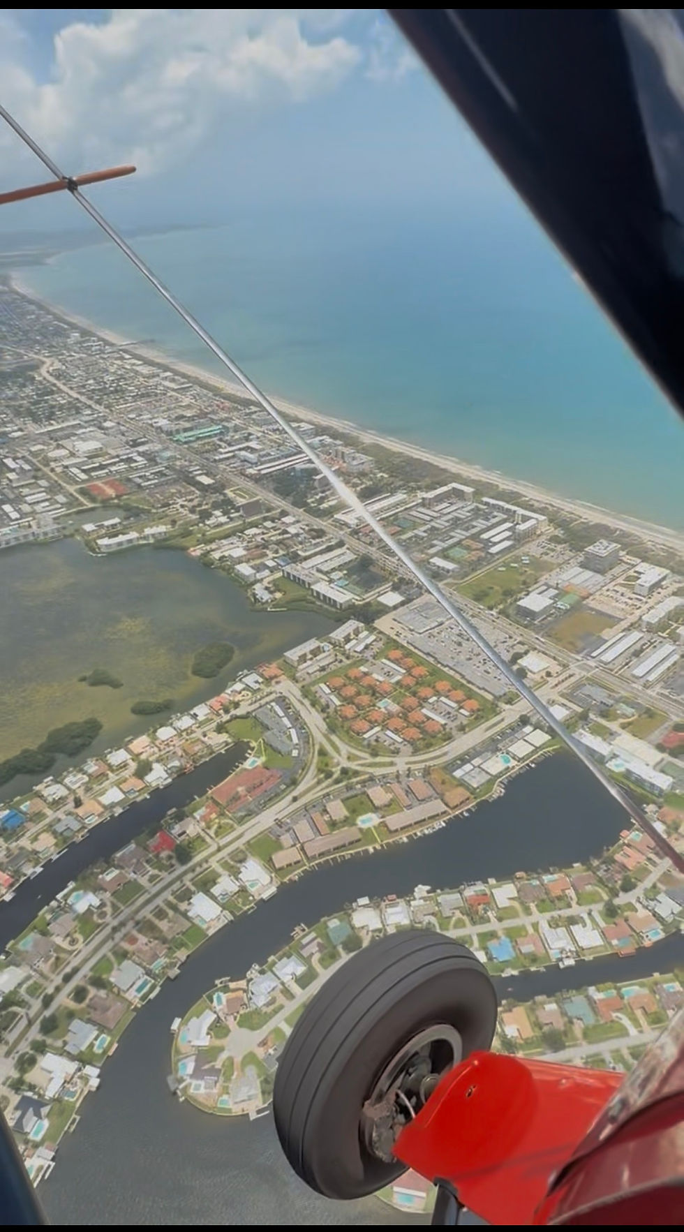 Open-cockpit aerial view during Florida Air Tours flight