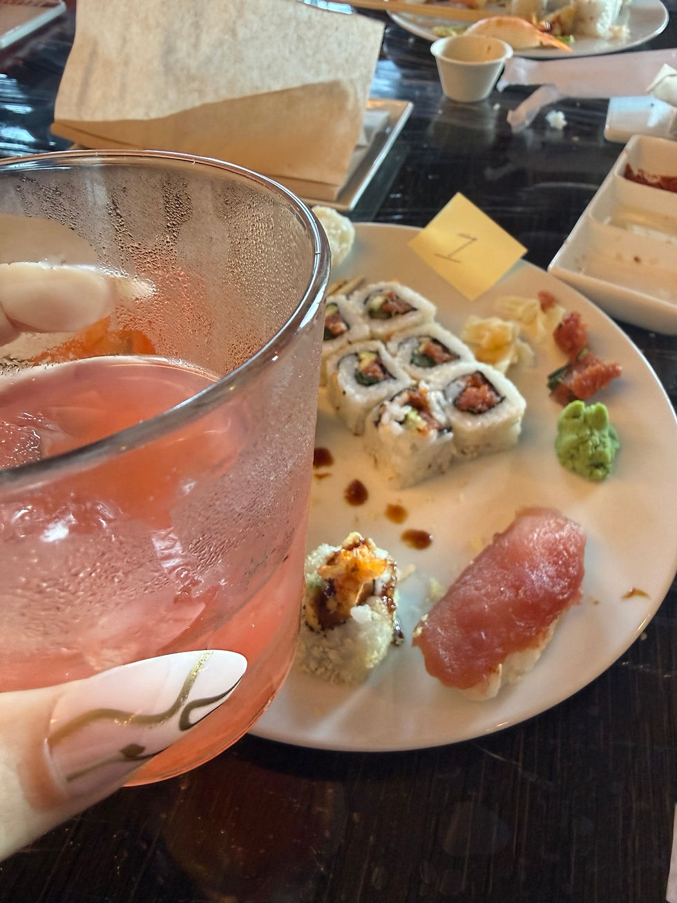 Pink non-alcoholic drink and handmade sushi during the Izumi sushi making class on Harmony of the Seas
