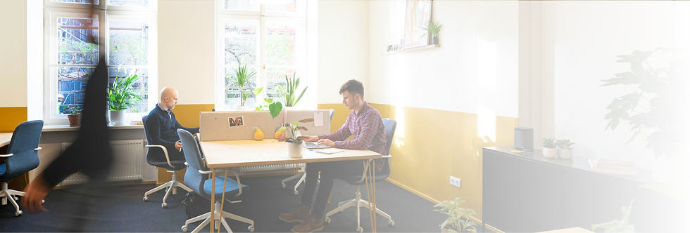 Men working in a yellow office