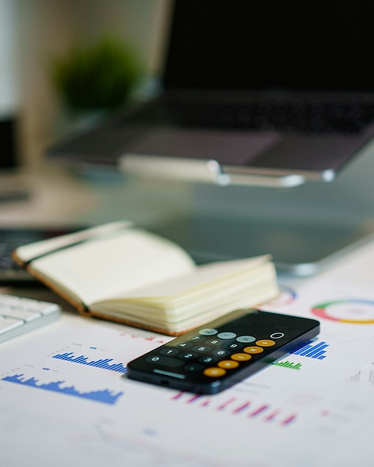 Note book, calculator and plans