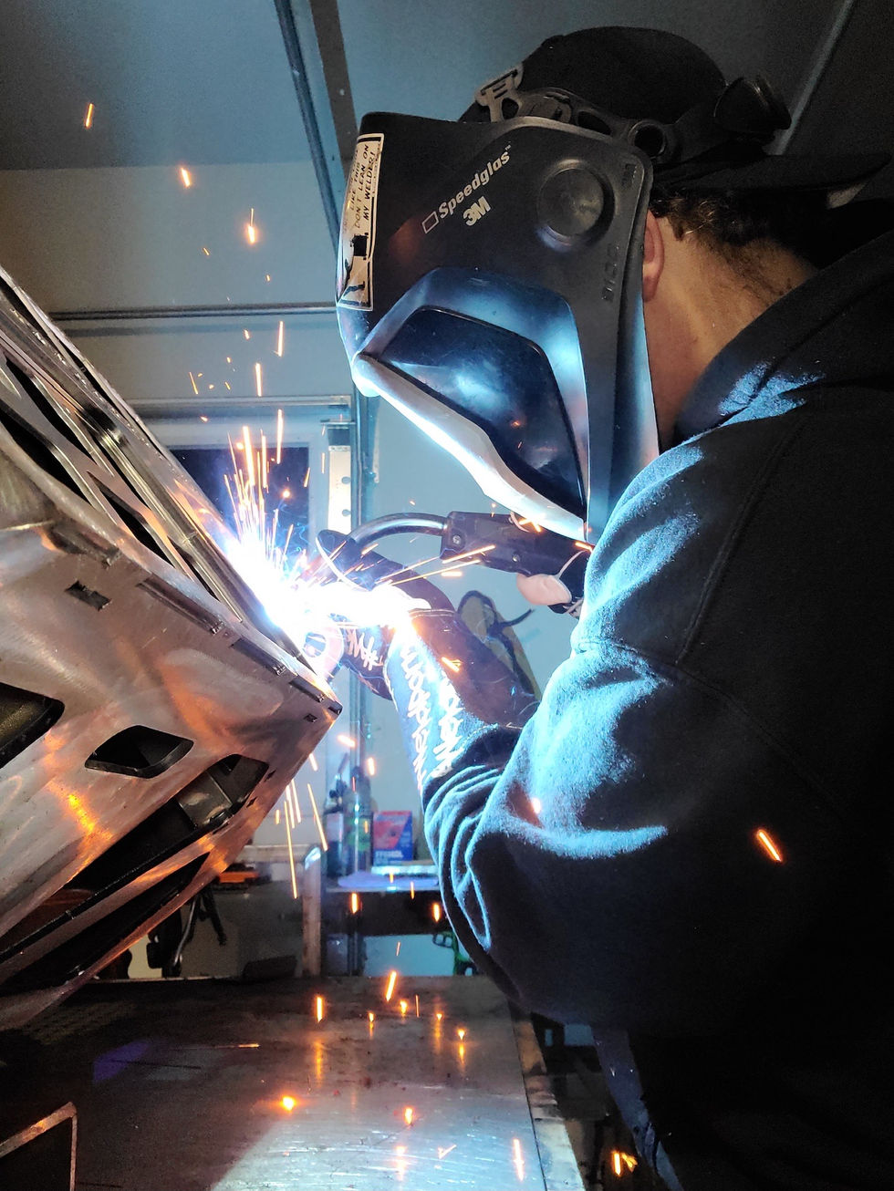 Assembling components through welding to a custom-designed bumper