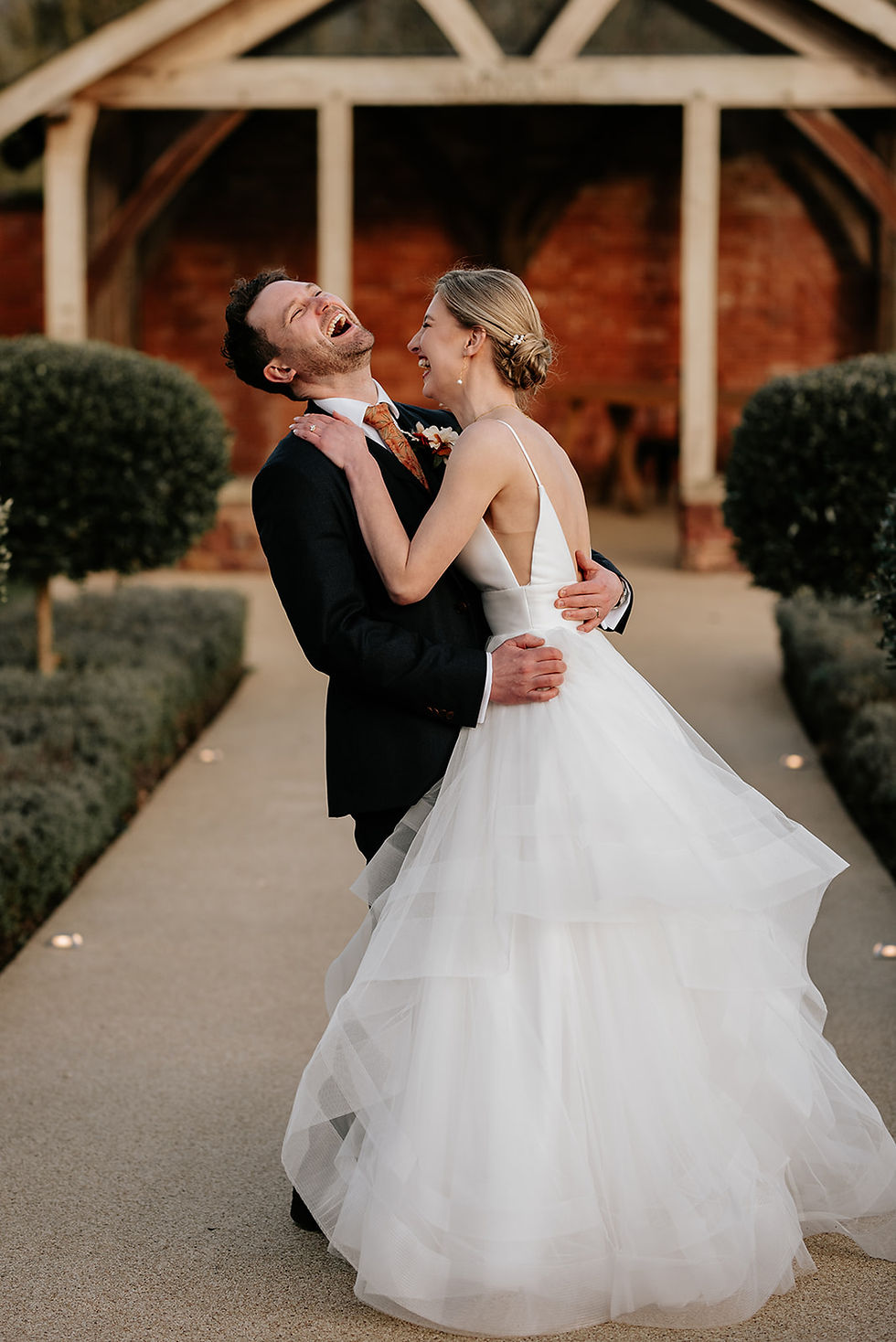 Bride and groom laugh together