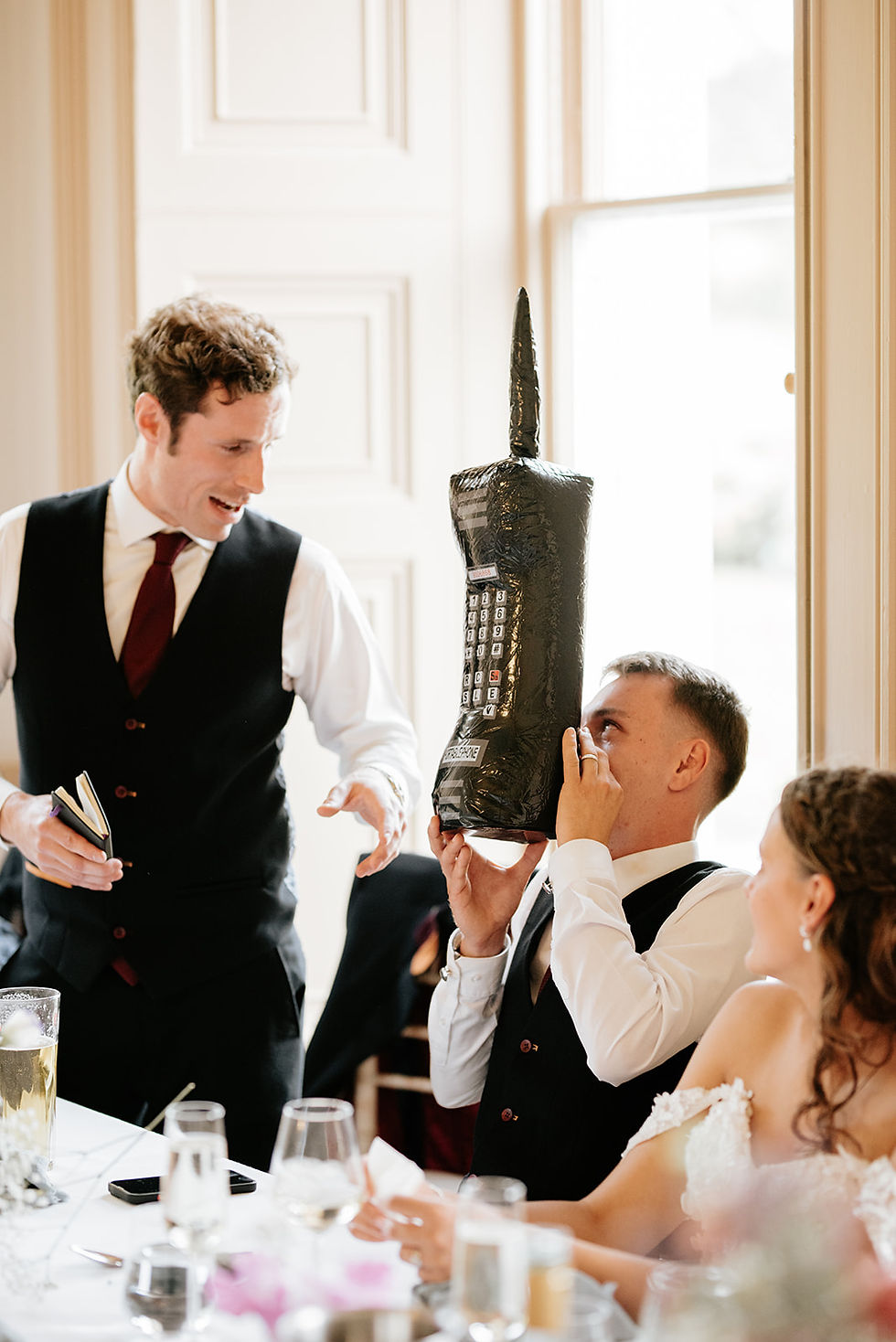 Best man gives groom a fun prop during speech