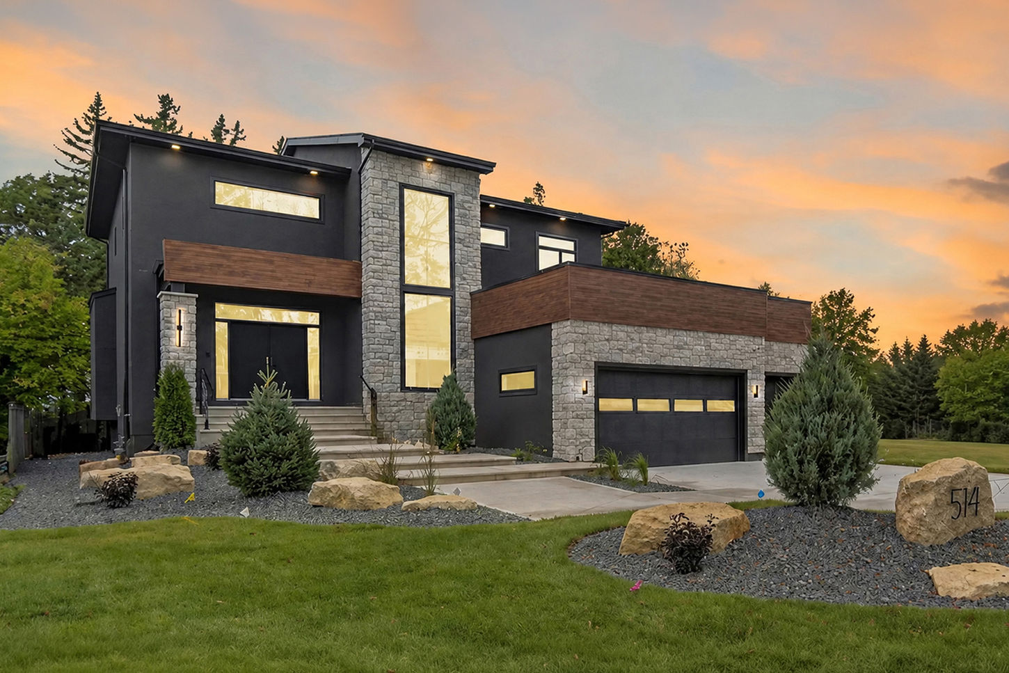 Sunset exterior view of 514 Bower Boulevard with modern architecture, large windows, and warm evening lighting.