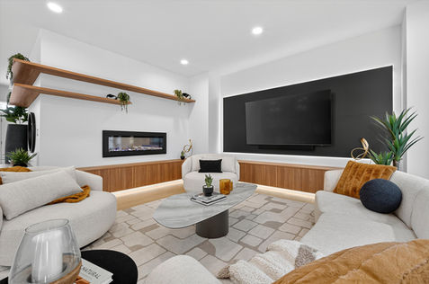 Great room at 514 Bower Boulevard with fireplace, entertainment wall, built-ins, and modern seating area.