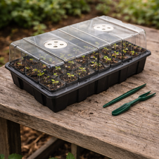 Reusable seed starting tray prepared for planting seeds on a garden work surface
