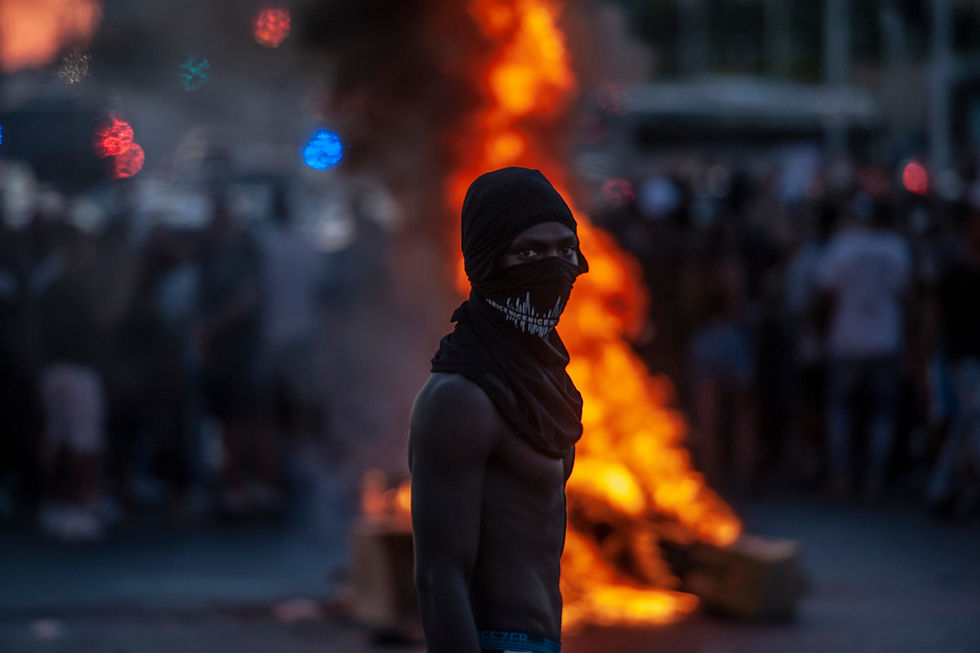 A young man of Ethiopian background during the blocking of the southern entrance to Ashdod as part of the Ethiopian community’s protest.