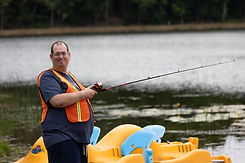 camper having a wonderful time fishing at camp