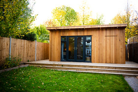 Contemporary cedar garden room. Home office. Games room. Garden transformation. Surrey UK.
