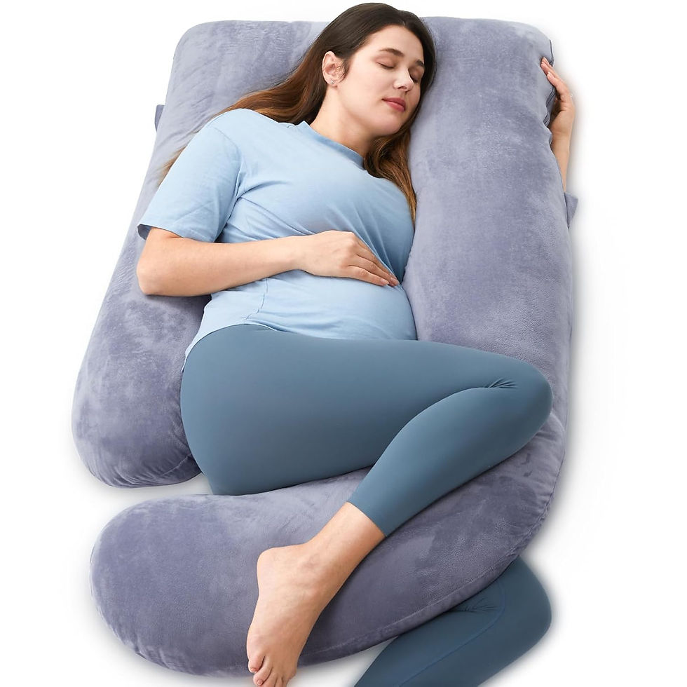 Pregnant woman in blue outfit comfortably sleeping on a large gray U-shaped pillow, eyes closed, peaceful mood. maternity pillow