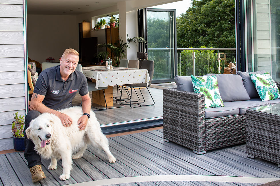 Simon Thomas of Simon Thomas Deck and Design relaxing on one of his award winning composite decks in Swansea