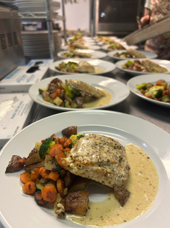 Family enjoying Alaska cuisine at our Alaska Fishing Lodge