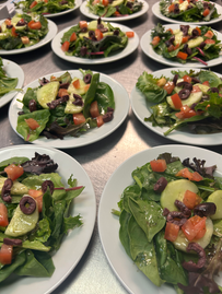Family enjoying Alaska cuisine at our Alaska Fishing Lodge