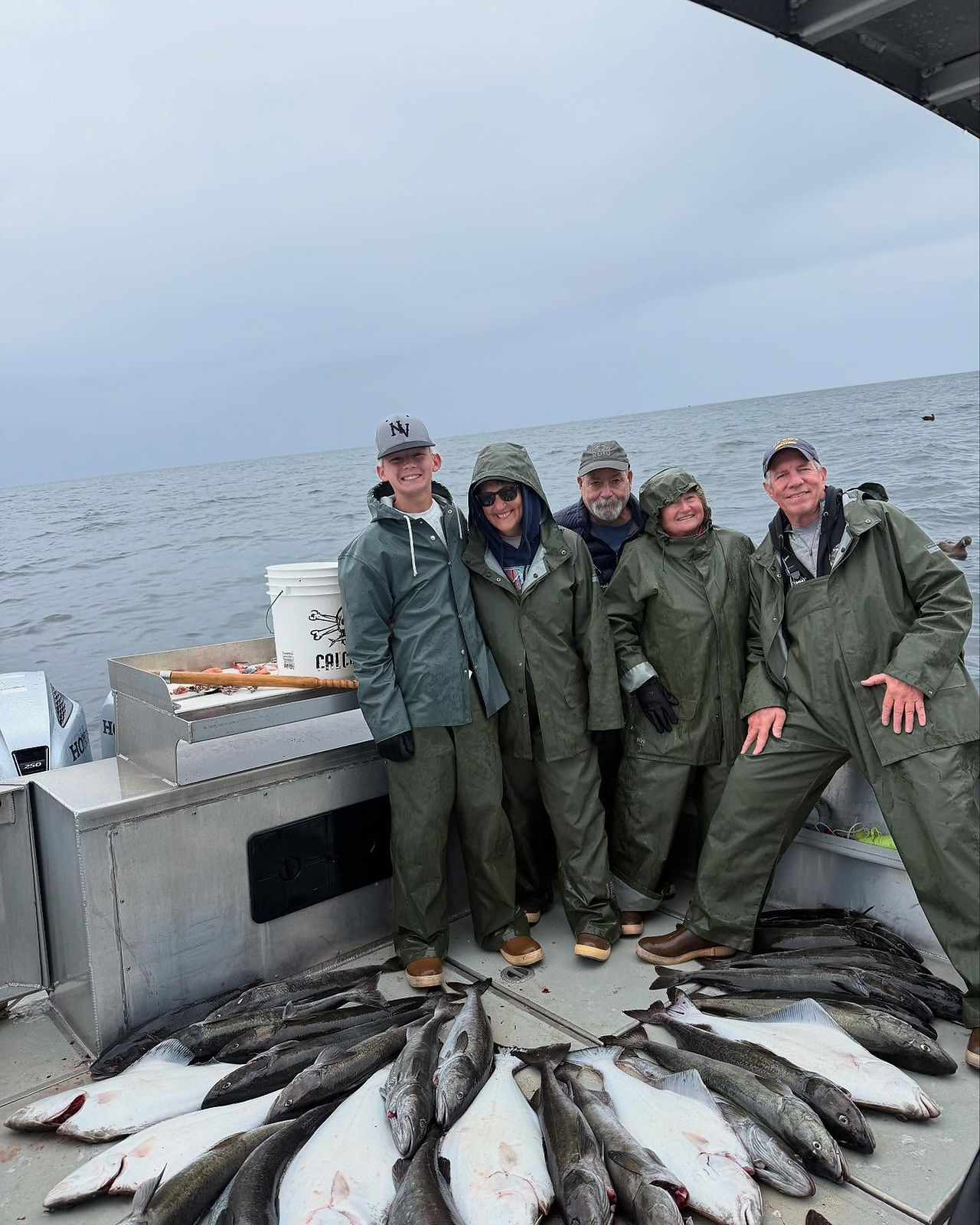Groups posing with their fishing catch at our Alaska Fishing Resort