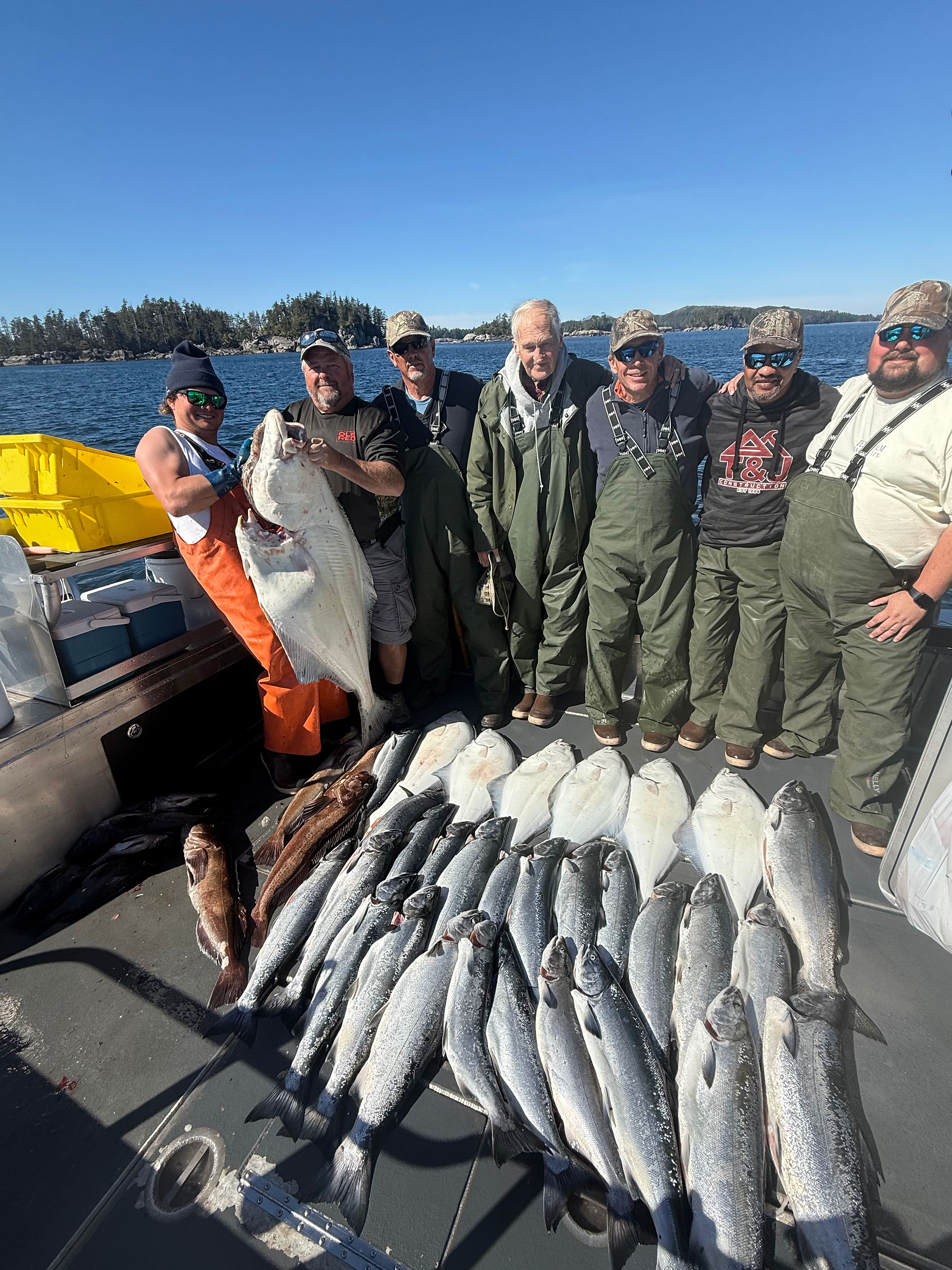Group of fishermen showing off their catch from a Sitka Alaska fishing adventure
