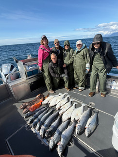 Group of fishermen showing off their catch from a Sitka Alaska fishing adventure