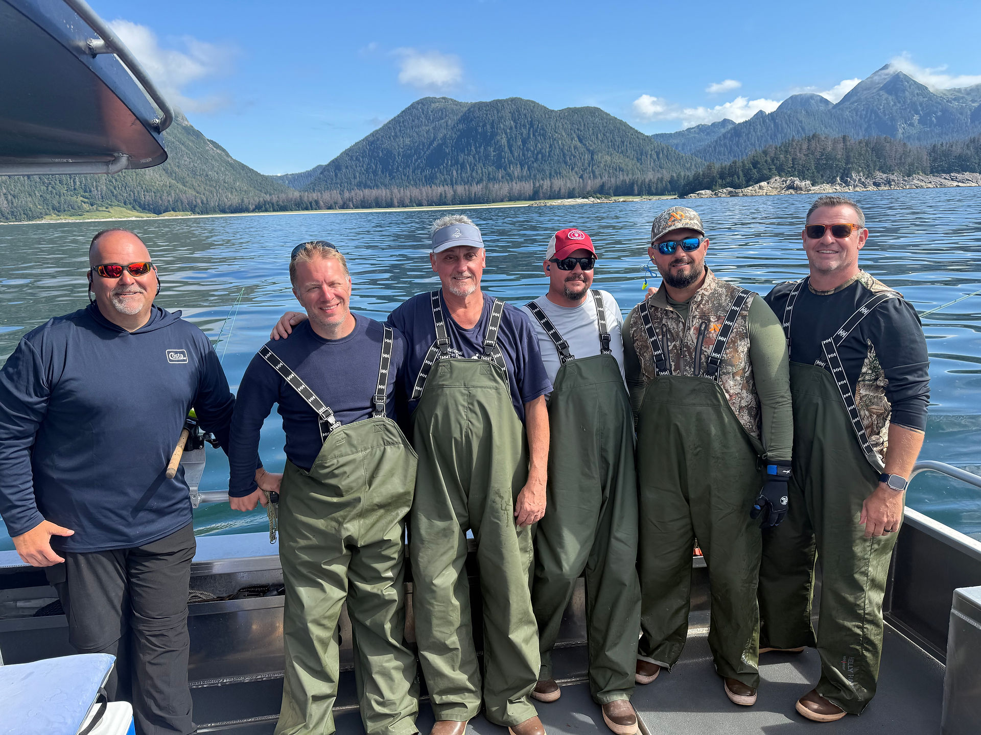 Group of fishermen showing off their catch from a Sitka Alaska fishing adventure