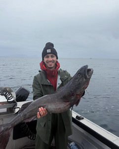 Groups posing with their fishing catch at our Alaska Fishing Resort