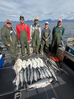 Group of fishermen showing off their catch from a Sitka Alaska fishing adventure