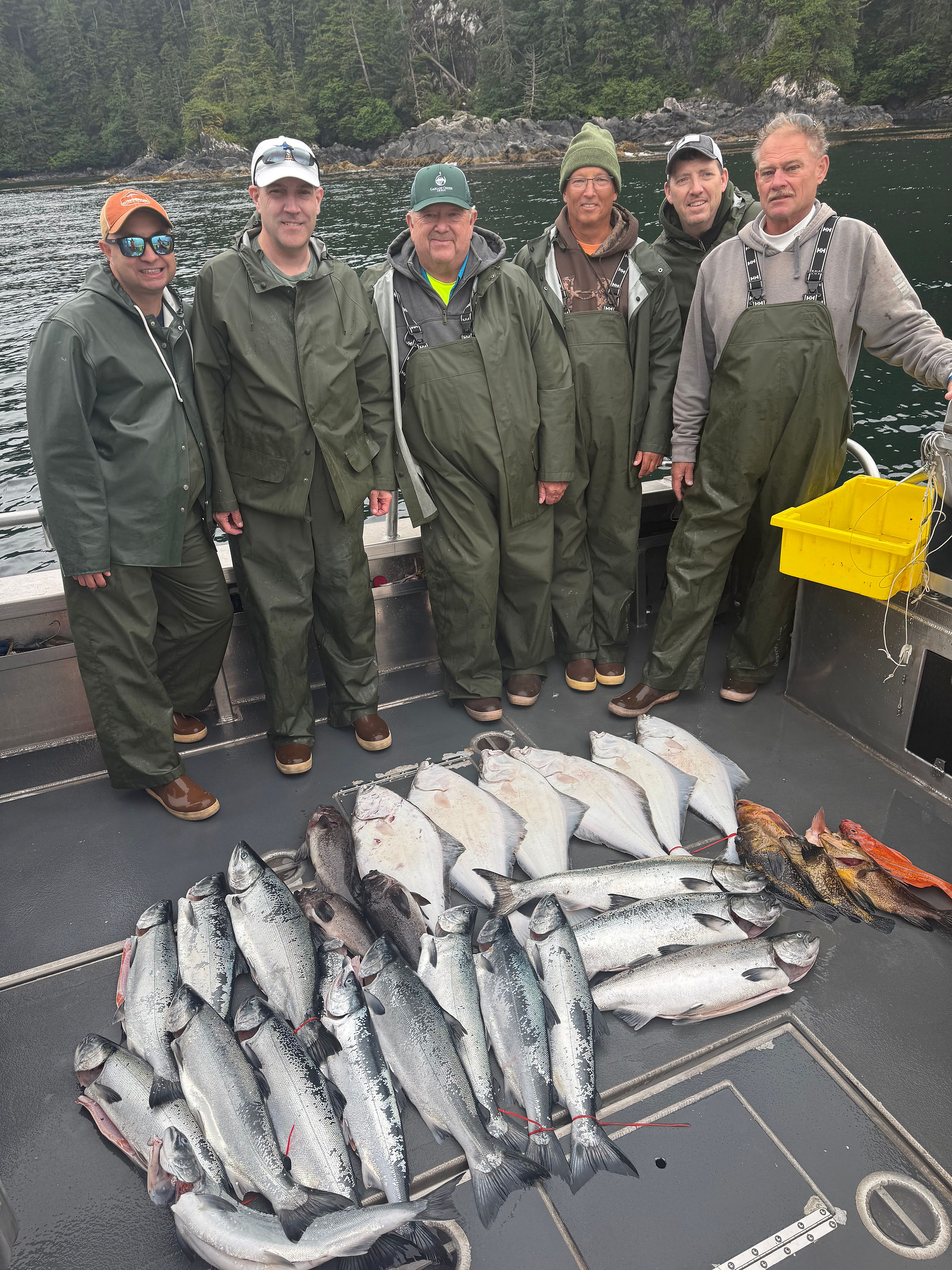 Group of fishermen showing off their catch from a Sitka Alaska fishing adventure