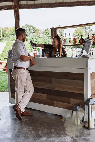 Bartender serving a cocktail at event
