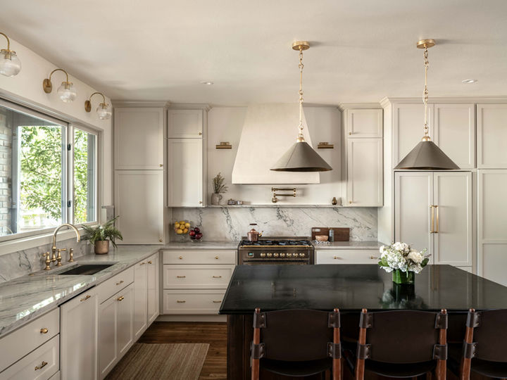 Kitchen remodel with traditional, neutral elements and brass accents.