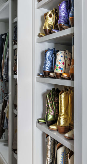 Closet system design featuring eclectic cowboy boots