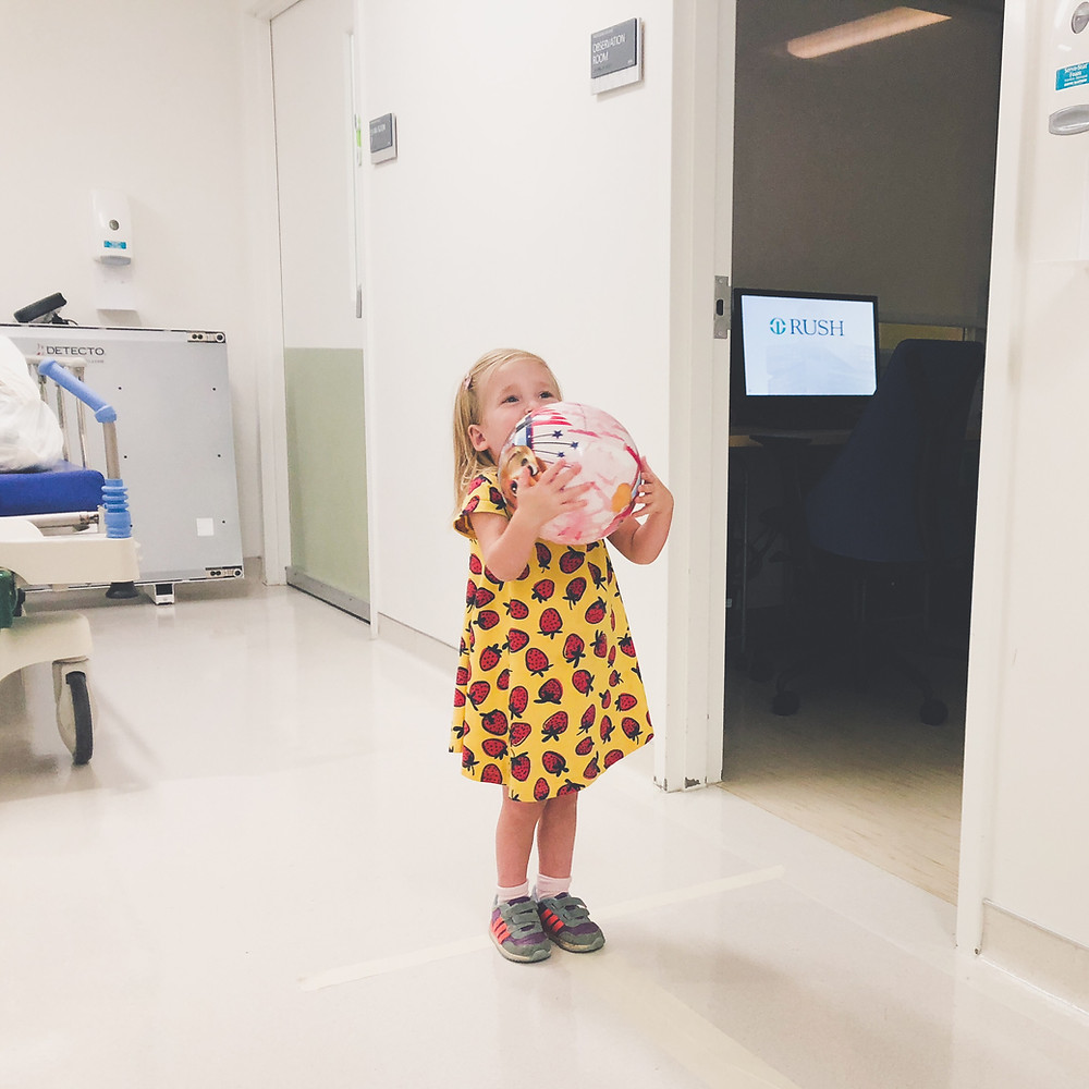 catching the ball during her gross motor assessment