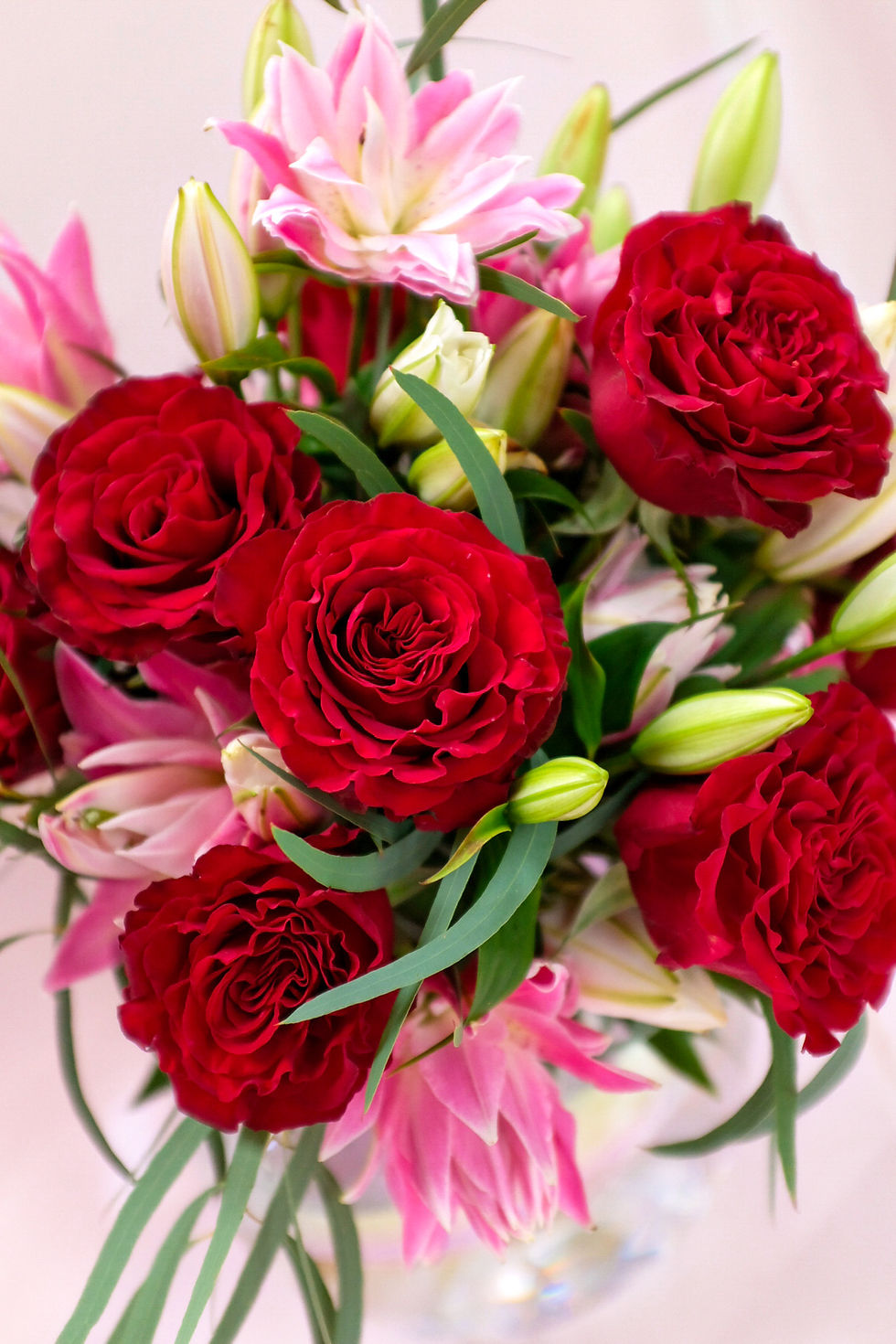 Thumbnail: Valentines 12 Red Roses and Pink Lilies Hand Tied Bouquet