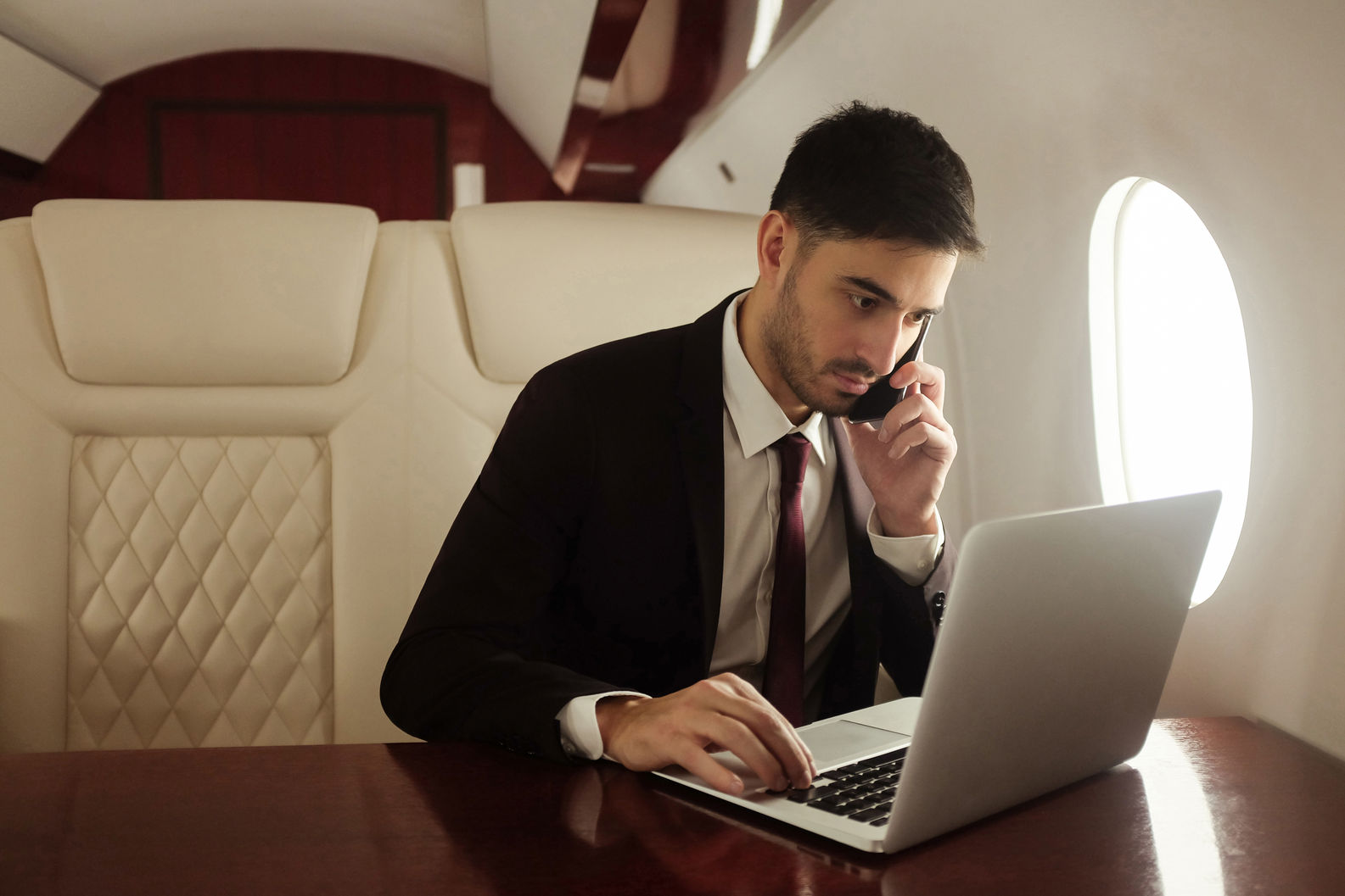 billionaire-or-rich-businessman-flying-first-class-2022-02-23-18-50-44-utc.jpeg