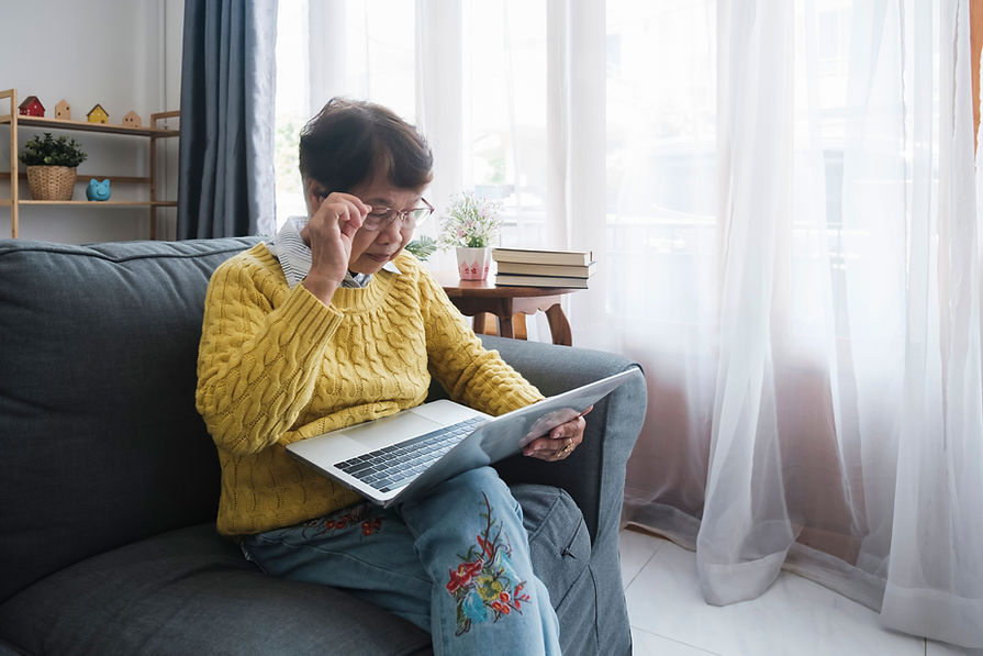 the-senior-asian-woman-sitting-on-sofa-and-using-n-2023-11-27-05-15-32-utc.jpg