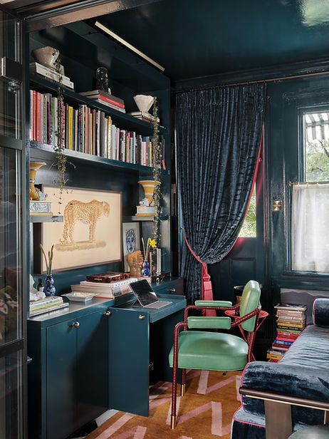 Colourful London apartment living room with velvet furnishings, bespoke joinery and layered textures.