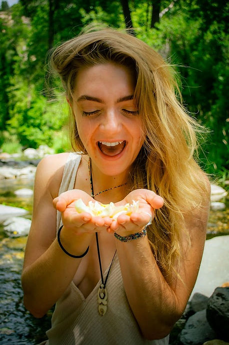 Happy woman with flowers at Oak creek
