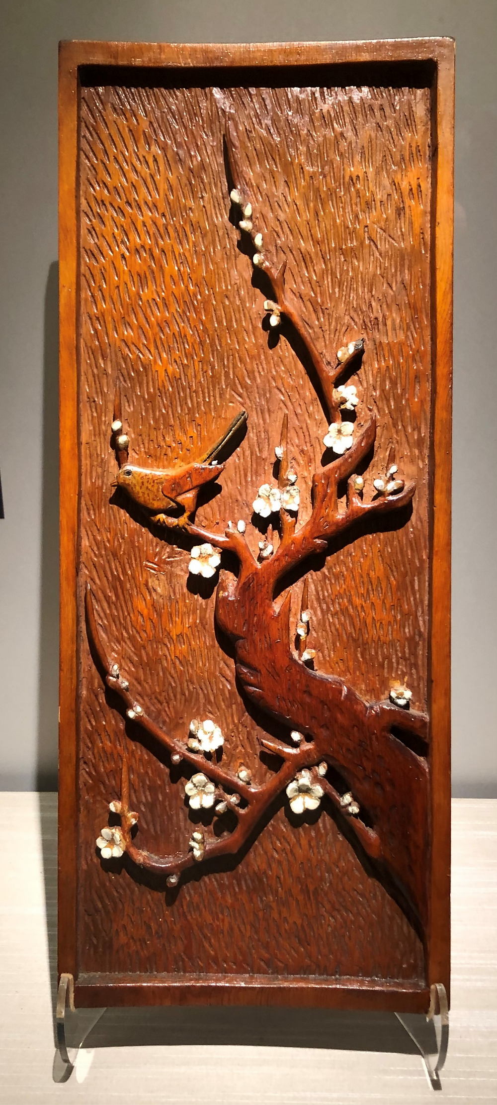 Plum and Nightingale Carving, c. 1942 – 1945. Crafted by an unknown Issei man while held at Tule Lake concentration camp during WWII.