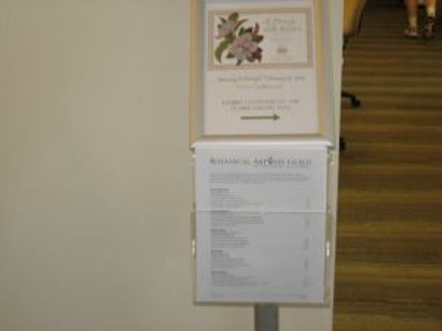 Stand with sign and price list.