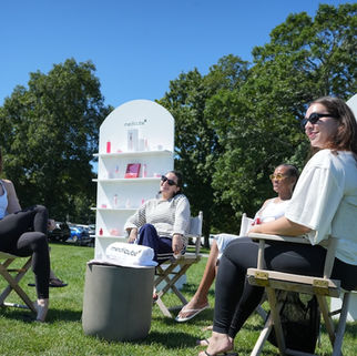 Beauty and lifestyle guests gather within Medicube’s branded wellness environment at Montauk Yacht Club.