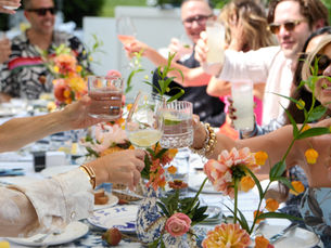 People cheers at Hamptons luncheon party East Hampton