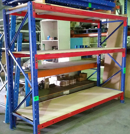 Red and blue industrial shelving in a warehouse