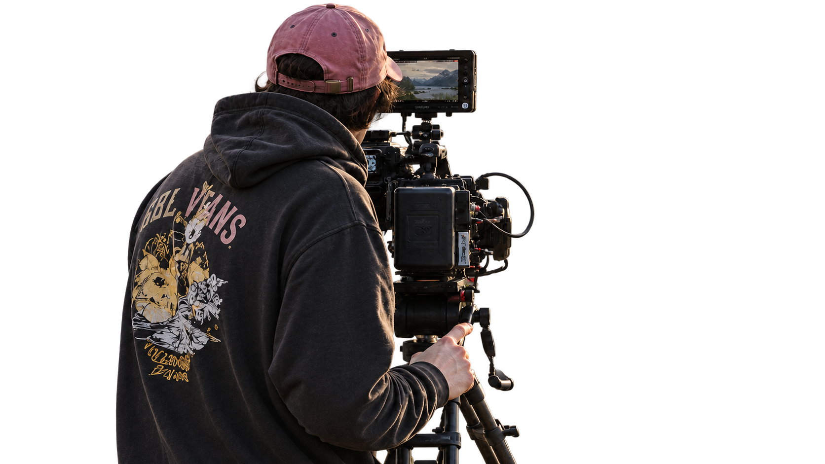 A videographer in a pink cap with a camera, monitor and tripod.