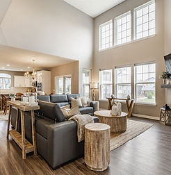Two-story great room with stone fireplace, staged for a real estate listing in IndianapolisVermillion Dr 06.jpg