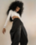 Wyne Kirabo Obugonvu (softness in english) combination with wide black silk trousers and white blouse with long sleeves