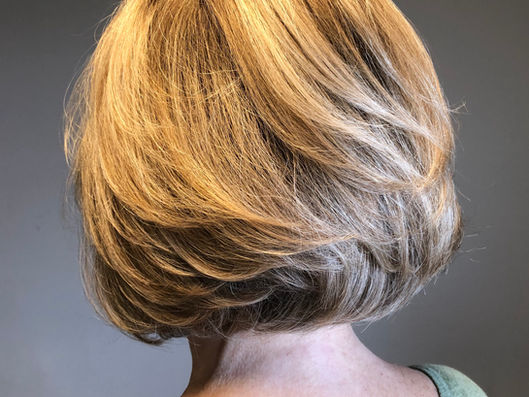 Demensional blond color and bob cut.
