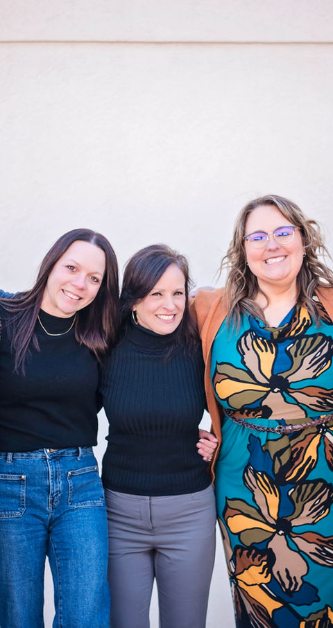 New Horizons Counseling Center counselors outside of the Ira Township location. Five St. Clair County therapists and counselors standing side by side smiling informally at the camera.