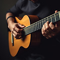 serious dark classical nylon string guitar player lower torso only.jpg